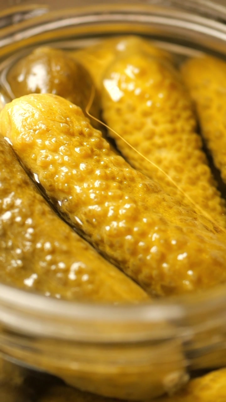 Close-up of Pickled Gherkins in a Glass Jar