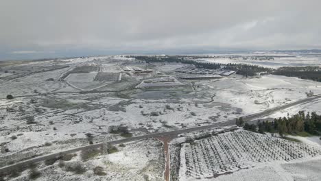 panoramic aerial drone view of snow covered countryside and farmland, ortal, israel