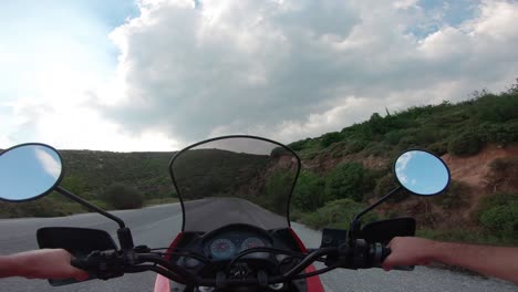 riding a motorcycle on penteli mountain in greece