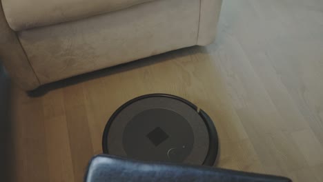 a robot vacuum is involved in maintaining the floor - close up