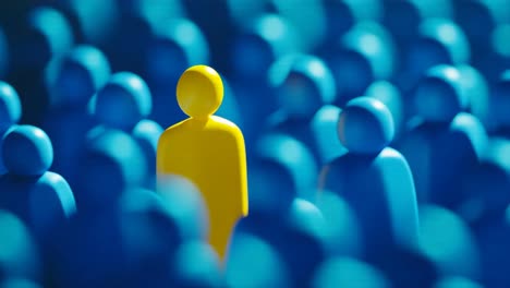 yellow figure among a blue crowd