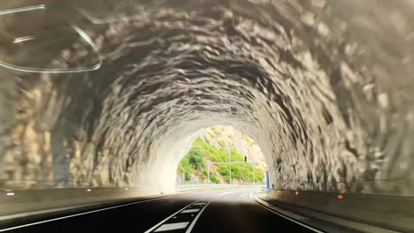 driving into a highway tunnel in the austrian mountainous region