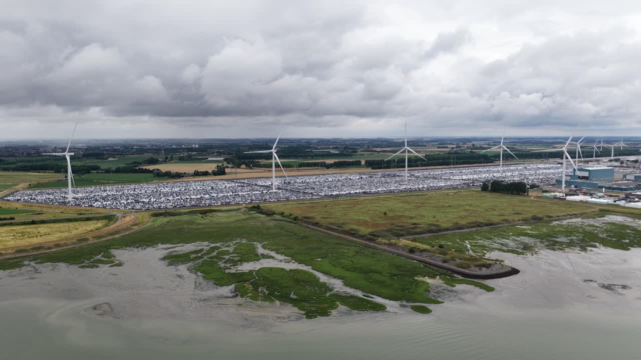 Hundreds of vehicles at the roll on roll off terminal in the Port of Vlissingen, Zeeland, logistics, port operations, global trade, and aerial video