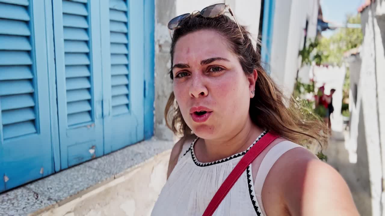 Young Woman Vlogging Among Pink Bougainvillea Flowers