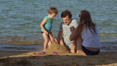 family spending time by the sea