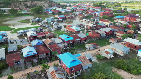 cambodian village built above swamp land tracking right