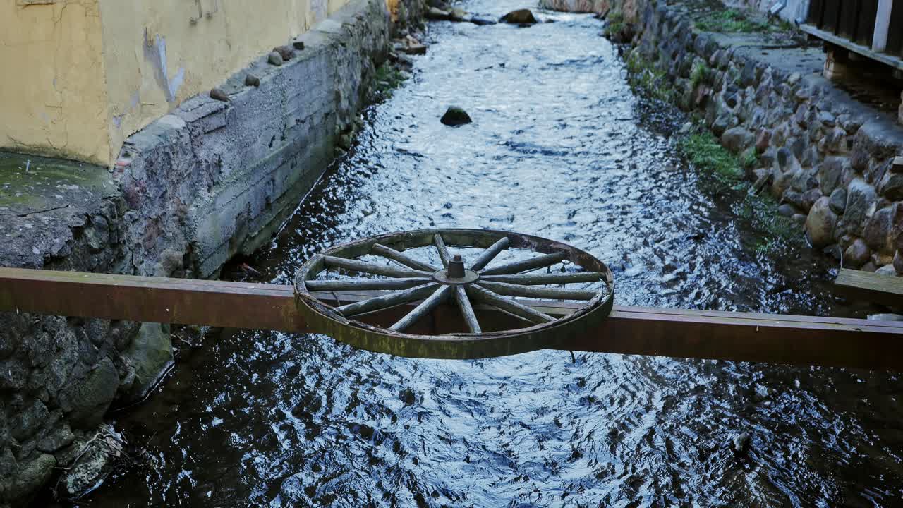 Creative bridge detail adds charm gently flowing waterway, old Kuldīga, Latvia
