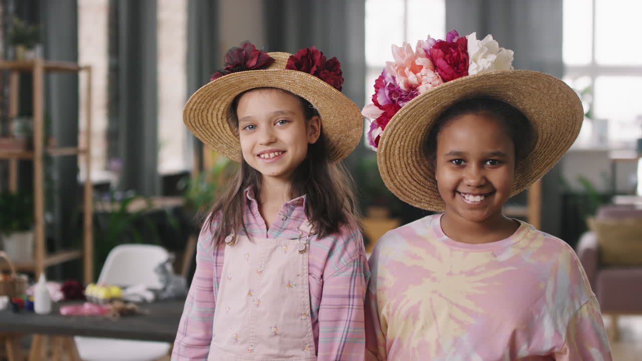Cute Girls in Straw Hats with Flowers