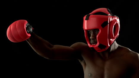 Tough-boxer-punching-with-red-gloves