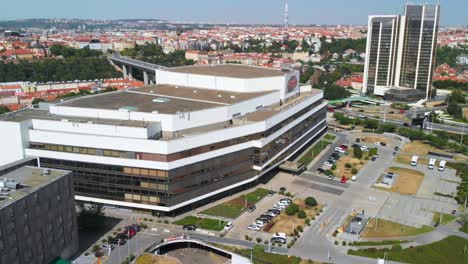 Side-aerial-drone-view-of-Prague-Congress-Centre-building,-fly-back