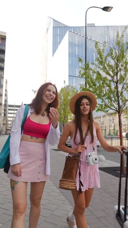 two women walking in a city