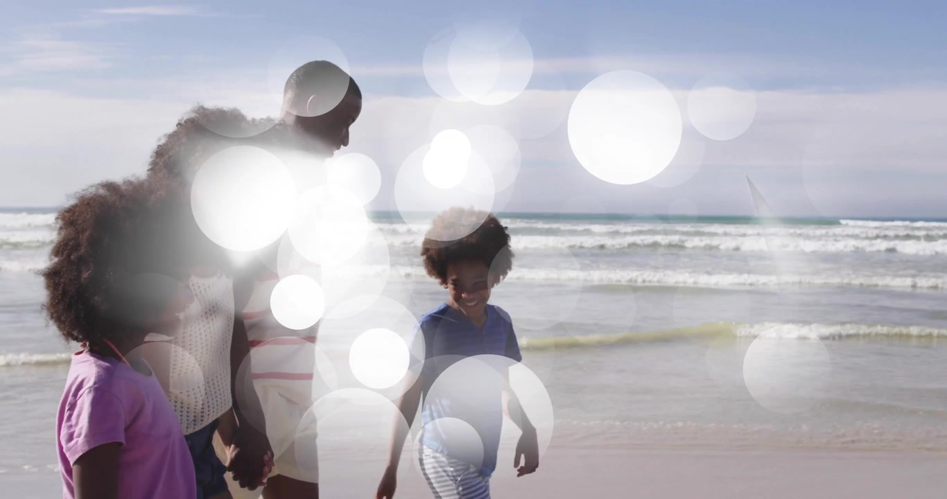 Family stepping onto shoreline and walking eastward while parents guiding children for travel ad