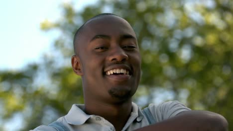 smiling young man posing to the camera