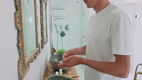 man, shaving foam and cleaning face in bathroom