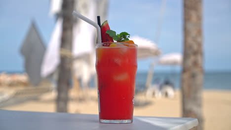 fresh fruit punch with sea beach background