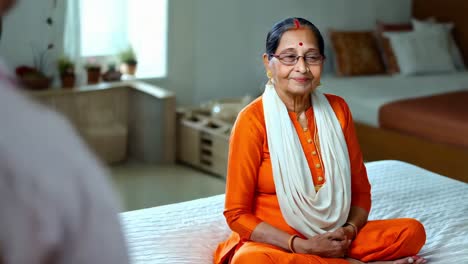 smiling elderly woman in traditional attire