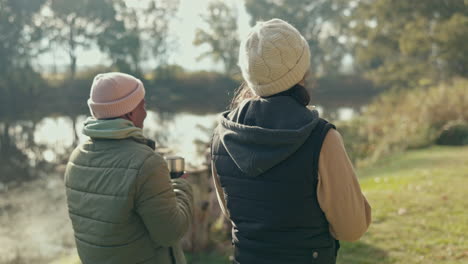 talking, happy and a couple walking in nature