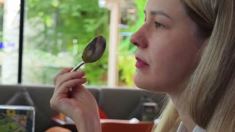 woman eating at a cafe