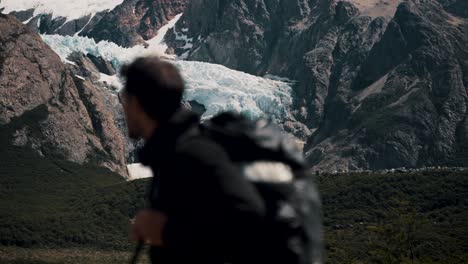 defocus hiker during mountain hike in cerro fitz roy near el chaltén in patagonia, argentina