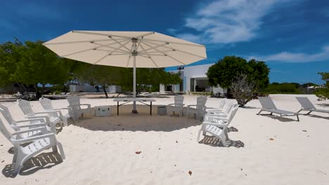 umbrella canopy over white sand beach provides pleasant shade and a cozy vibes, los roques