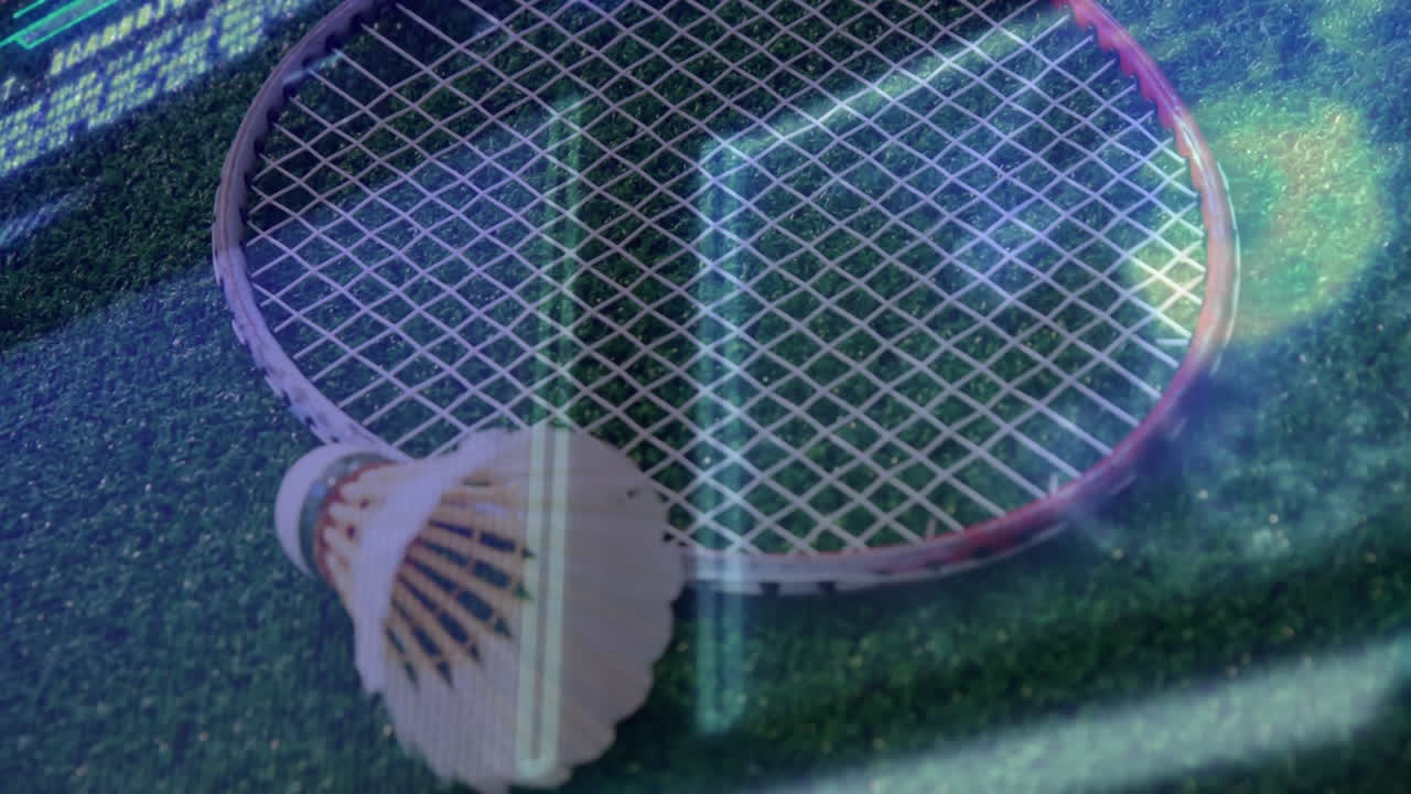Badminton racket lying flat beside shuttlecock on green court featuring neon graph lines shifting
