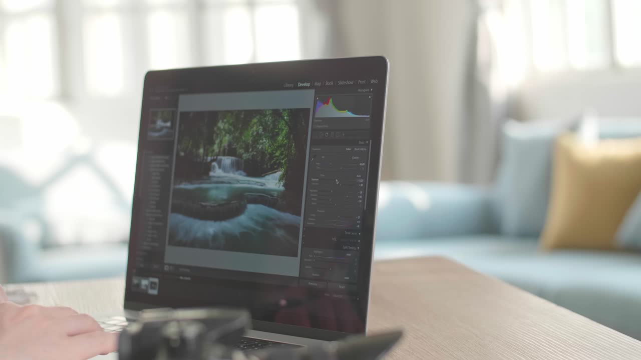 Close Up Man Works In Photo Editing App / Software On His Laptop Computer. Photo Editor Retouching Photos Of Beautiful Nature