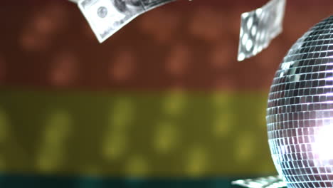 dollars falling against rainbow flag with spinning disco ball