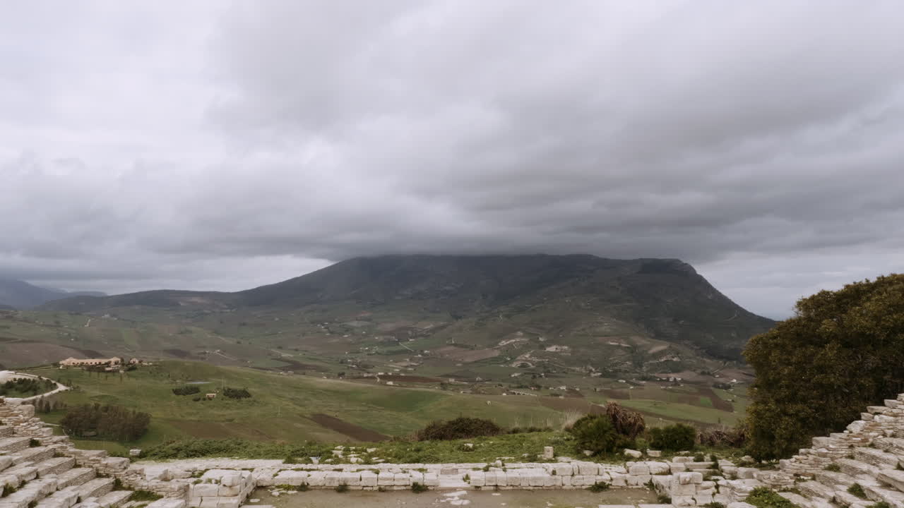 Ancient Amphitheater in the Italian countryside with a mountain view