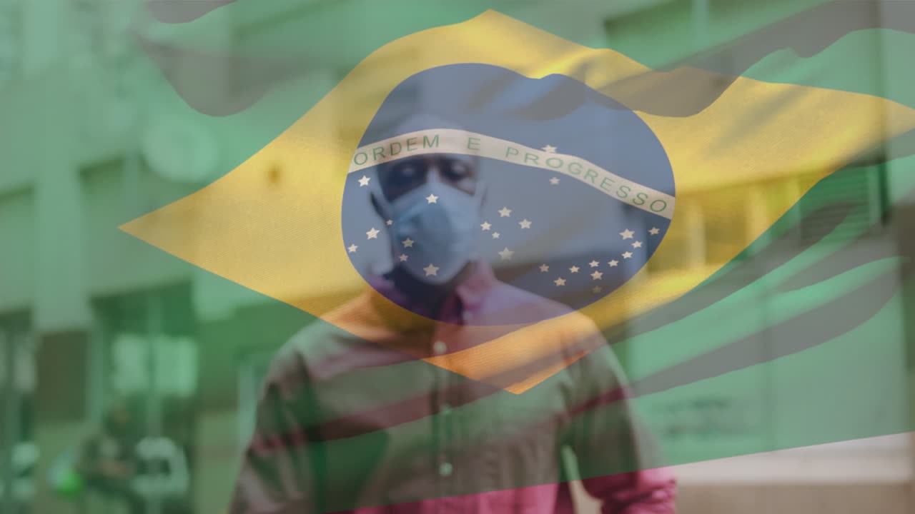 Animação da bandeira do Brasil tremulando sobre um homem usando máscara facial durante a pandemia de COVID-19.