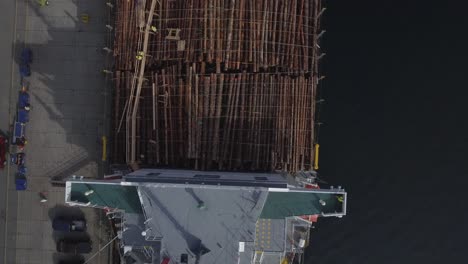 4K-Drone-footage-top-down-view-of-a-large-ship-being-loaded-with-logs