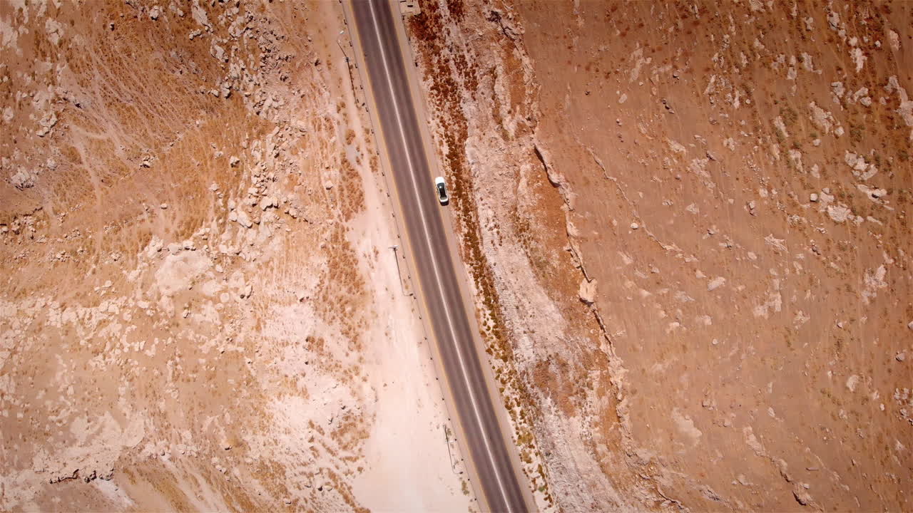Car parking on side Road in the desert aerial Flight top down view