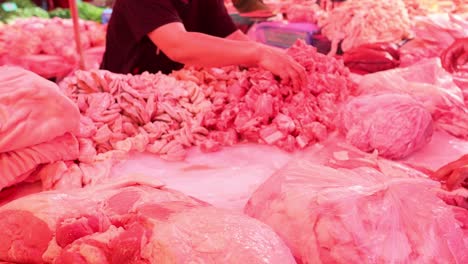 hands expertly preparing and processing meat