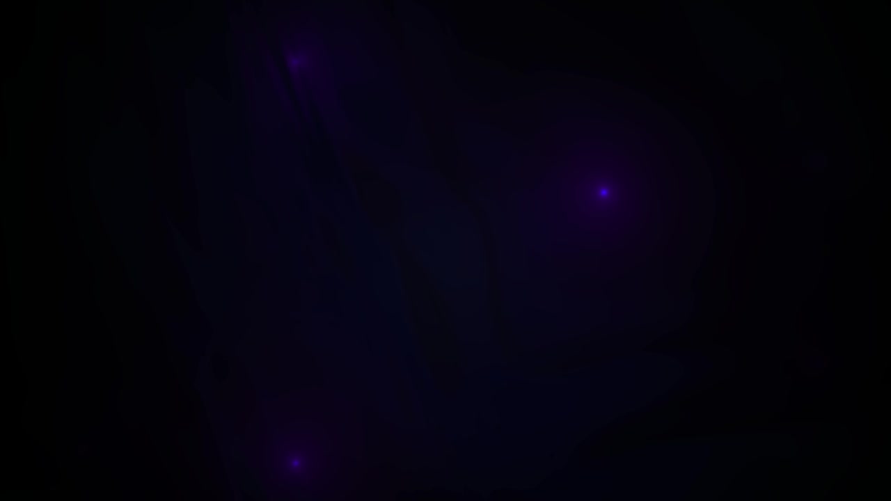 Sottili particelle luminose blu e viola nell'oscurità