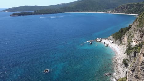 tilt up reveals wonderful coastline in montenegro. budva town, calypso beach. panoramic