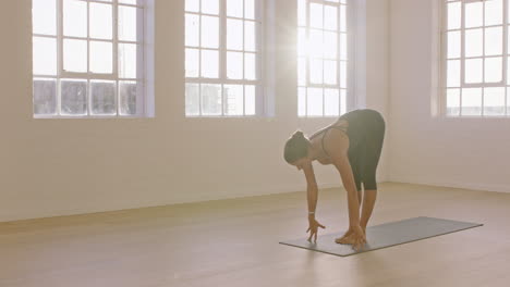 beautiful-yoga-woman-practicing-standing-forward-bend-pose-enjoying-fitness-lifestyle-exercising-in-studio-stretching-flexible-body-training-early-morning-meditation-on-exercise-mat