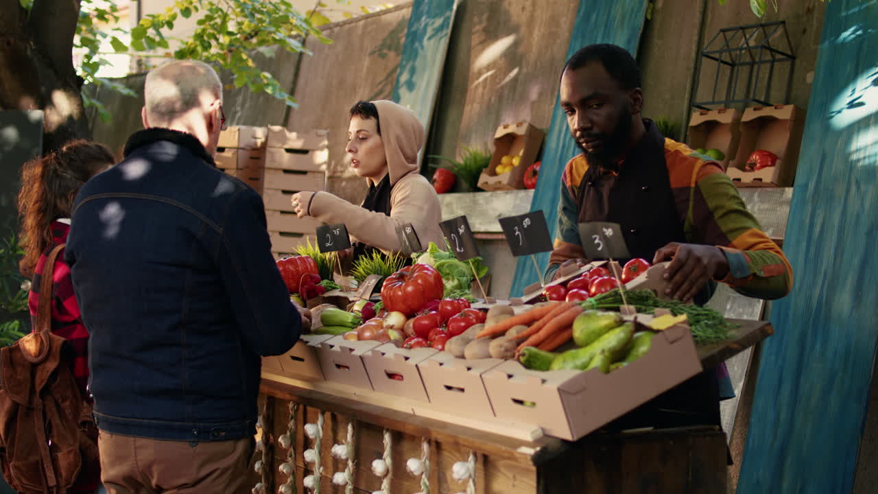 People at a Farmers Market Buying and Selling Produce