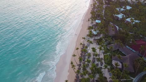 Aerial-drone-shot-of-the-ocean-in-the-Dominican-Republic-with-boats-standing-by