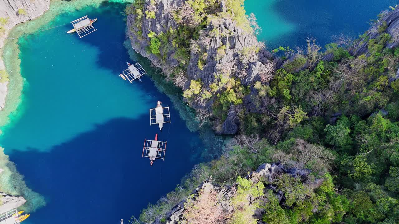 Drone footage of the twin lagoons and boats on Coron island in the Philippines