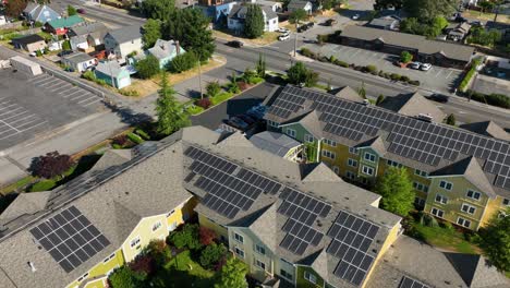 aerial rising above a retirement complex with solar panels lining the roof