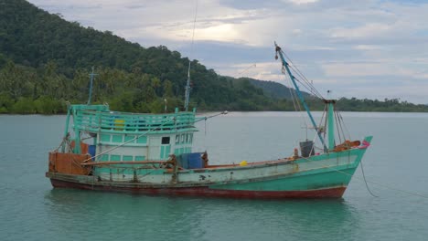 wooden fishing boat with beautiful sky in the background