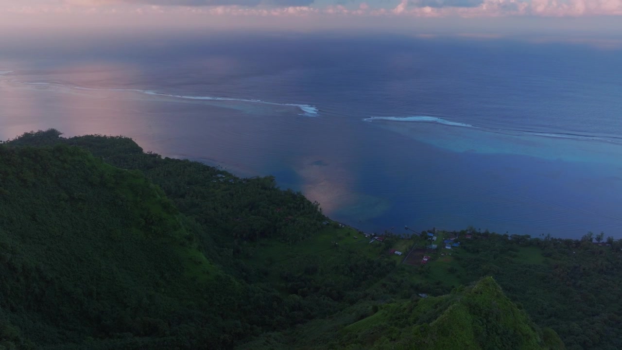 Tahiti Mountain Ridge coastline Teahupo'o South Pacific Ocean French Polynesia aerial drone early morning sunrise clouds Teahupo'o lagoon surfing Passe Havea coral reef break waves forward pan up