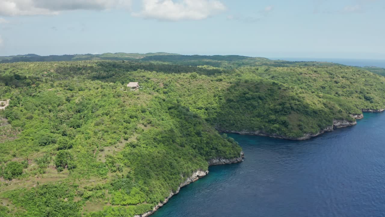 Stunning aerial drone view of Amok Sunset, a popular sunset point perched high on a cliff in Nusa Penida, Bali, Indonesia
