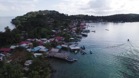 aerial view of a picturesque coastal village with stilt houses