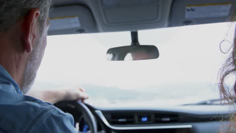 couple interacting in car 4k