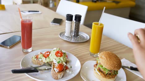 woman taking photo of food 4k