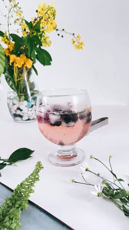 pink drink with berries and flowers