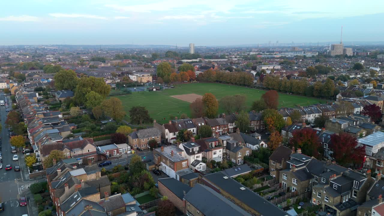 Aerial view Haydons Road Recreation Ground and surrounding homes in Wimbledon. Urban green space and community streets from above