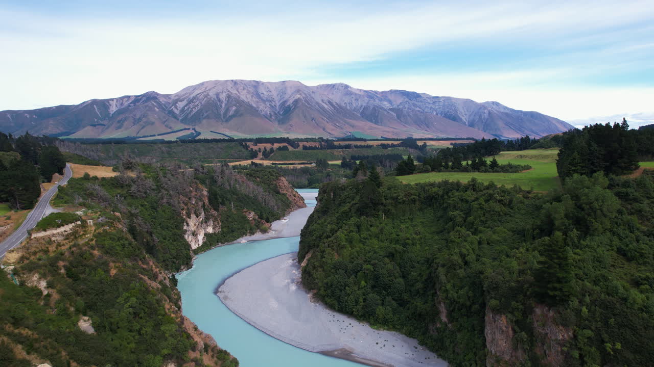 Aerial ascending shot above the Rakaia Gorge river, sunny day in New Zealand