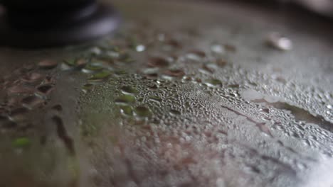 closeup steam inside of a pan with glass cover