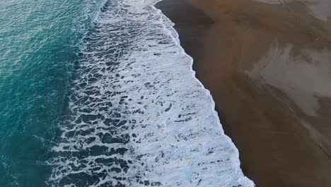 drone view of waves in agios georgios beach in corfu island greece